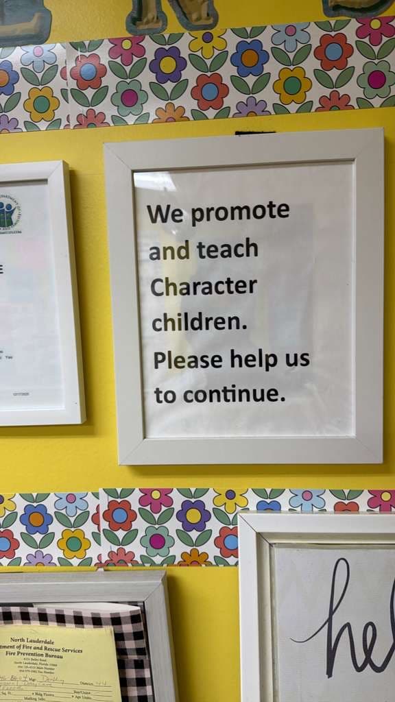 Framed quote in the FCIA hallway: 'We promote and teach character children. Please help us to continue.'